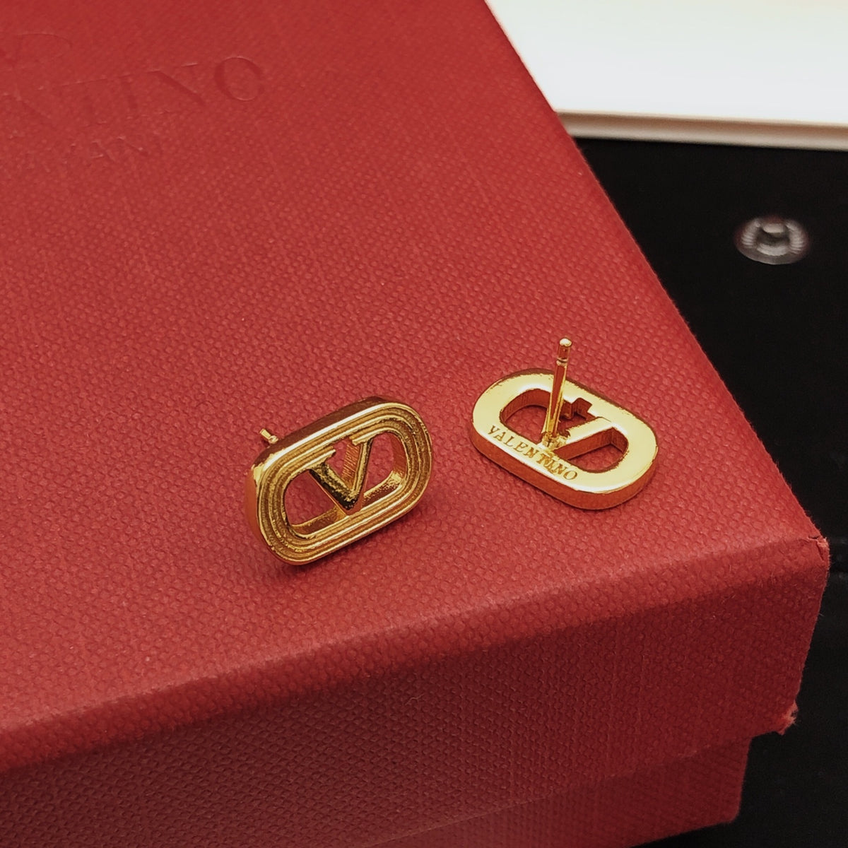 Signature Emblem Polished Stud Earrings – Design 04 styled detail