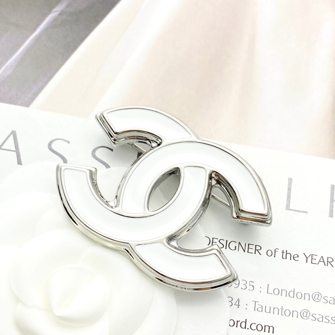 Double-C Emblem Brooch in Polished Metal-Tone – White Detail side detail