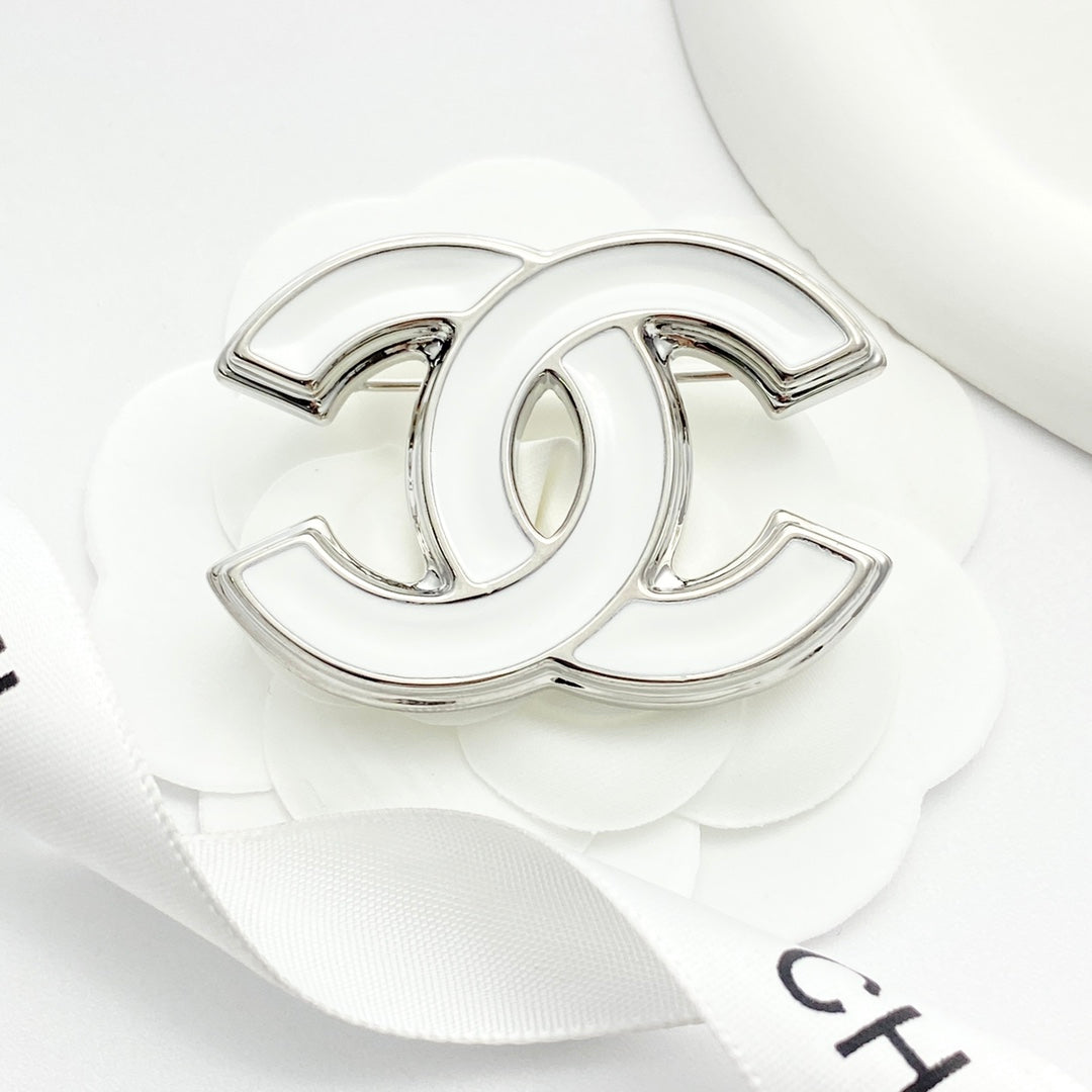 Double-C Emblem Brooch in Polished Metal-Tone – White Detail main product view
