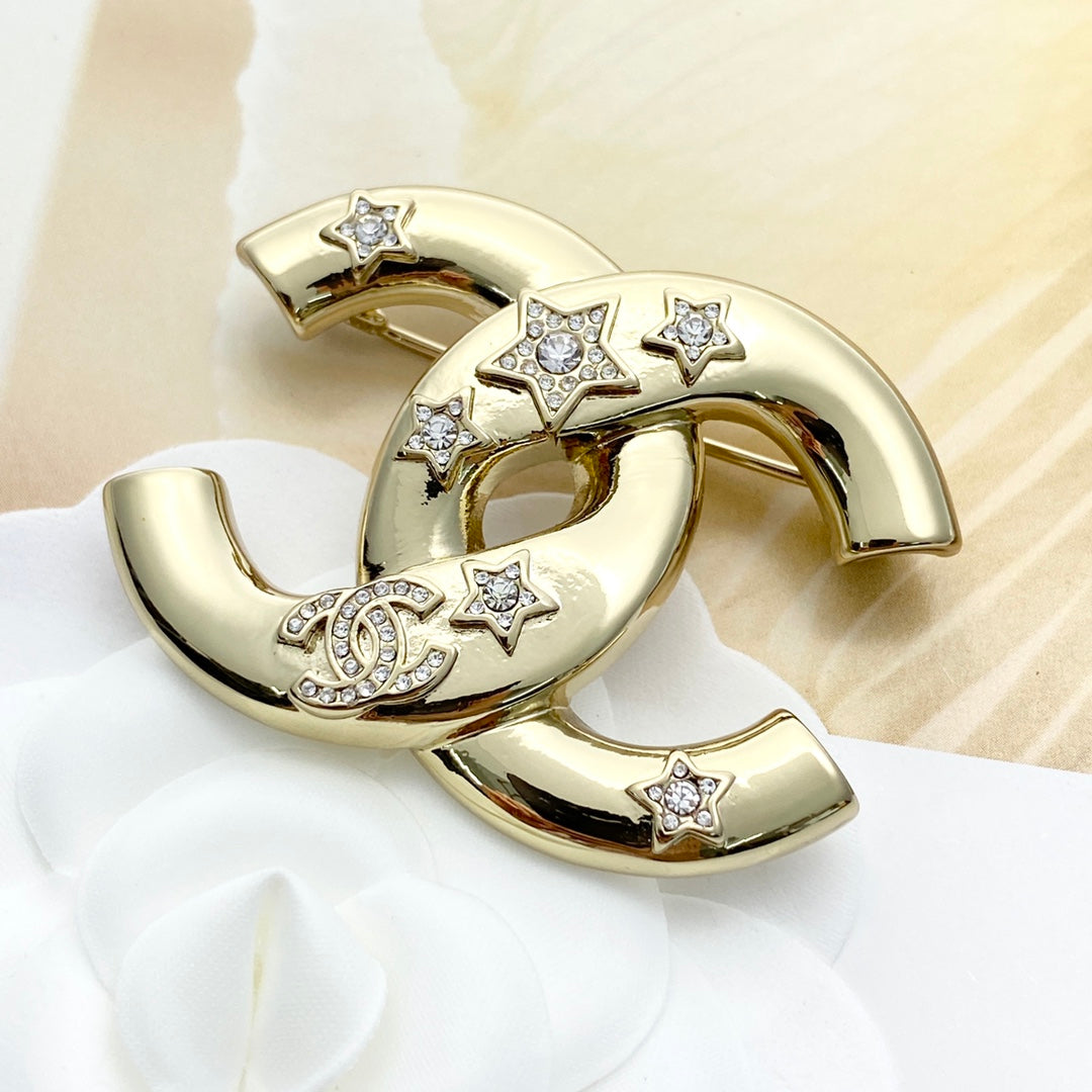 Double-C Emblem Brooch in Gold-Tone – Star Detail styled product view