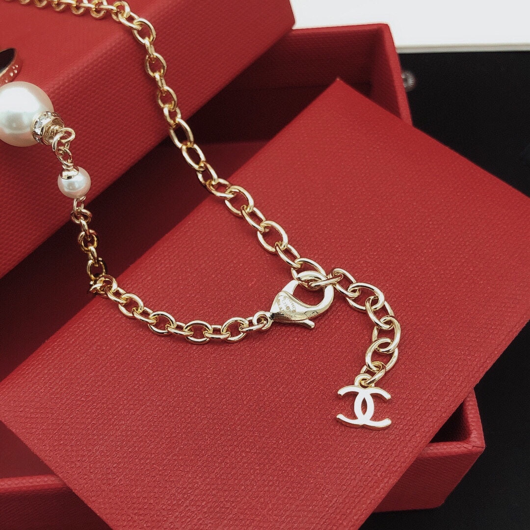 Signature Emblem Pendant Necklace in Gold-Tone – Pink Detail – Design 005 close-up detail