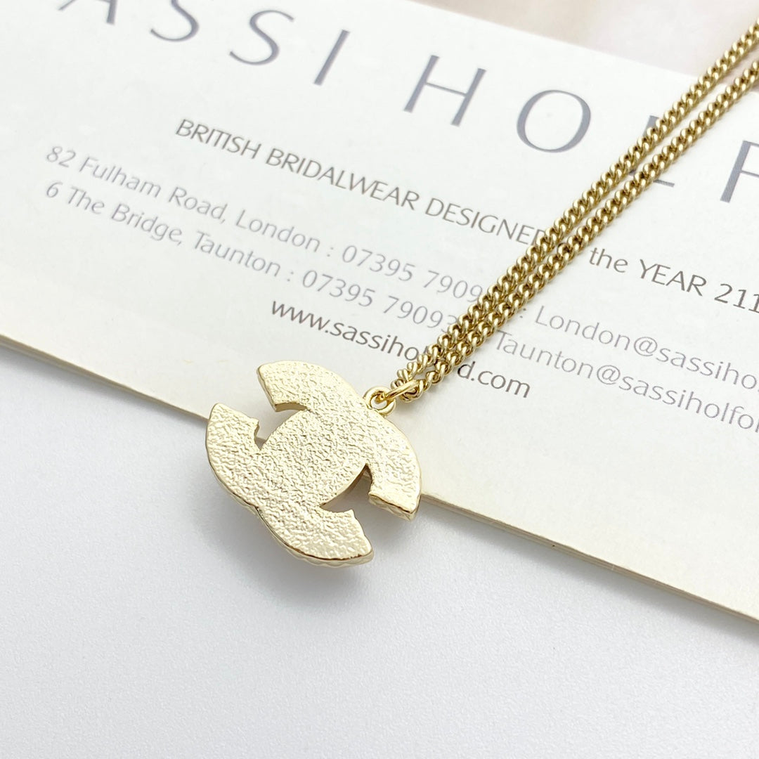 Signature Emblem Pendant Necklace in Gold-Tone – Pink Detail – Design 004 close-up detail