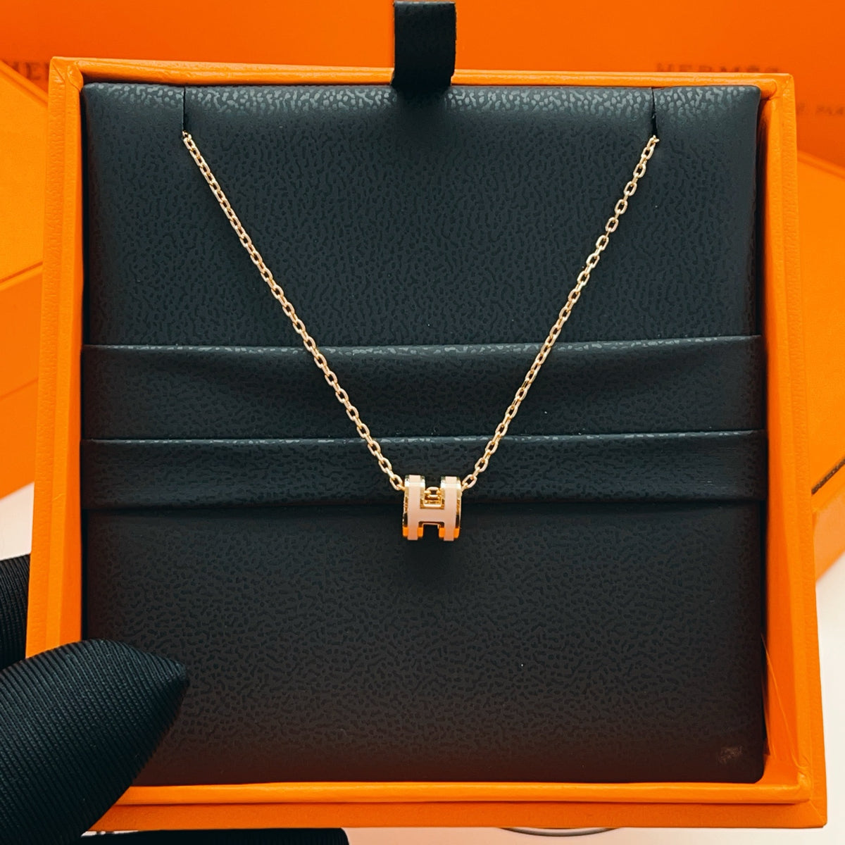 Geometric Emblem Pendant Necklace in Rose-Gold-Tone close-up detail