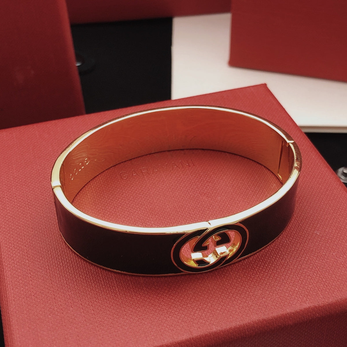 Geometric Emblem Bangle in Gold-Tone – Black Detail styled product view