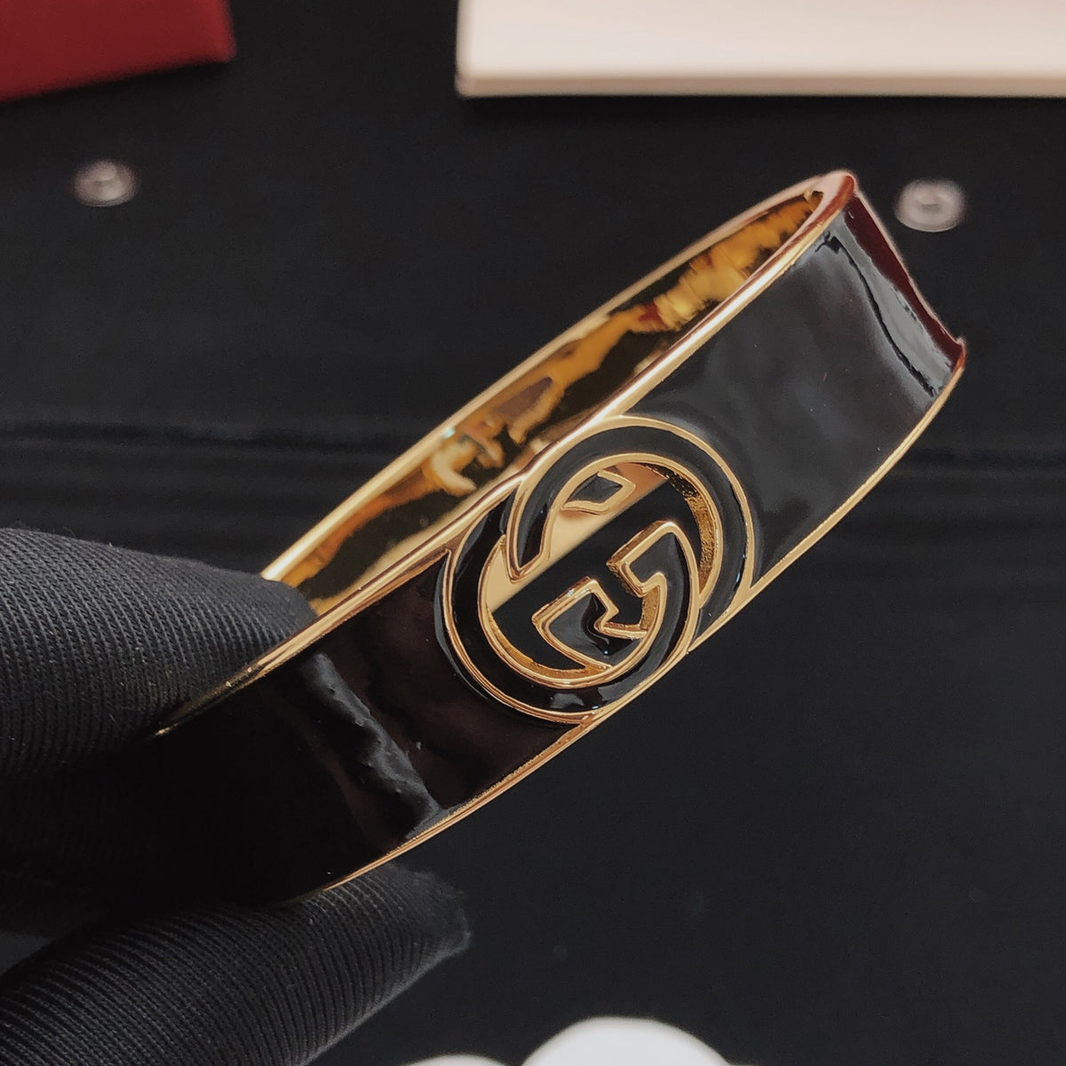 Geometric Emblem Bangle in Gold-Tone – Black Detail detail view