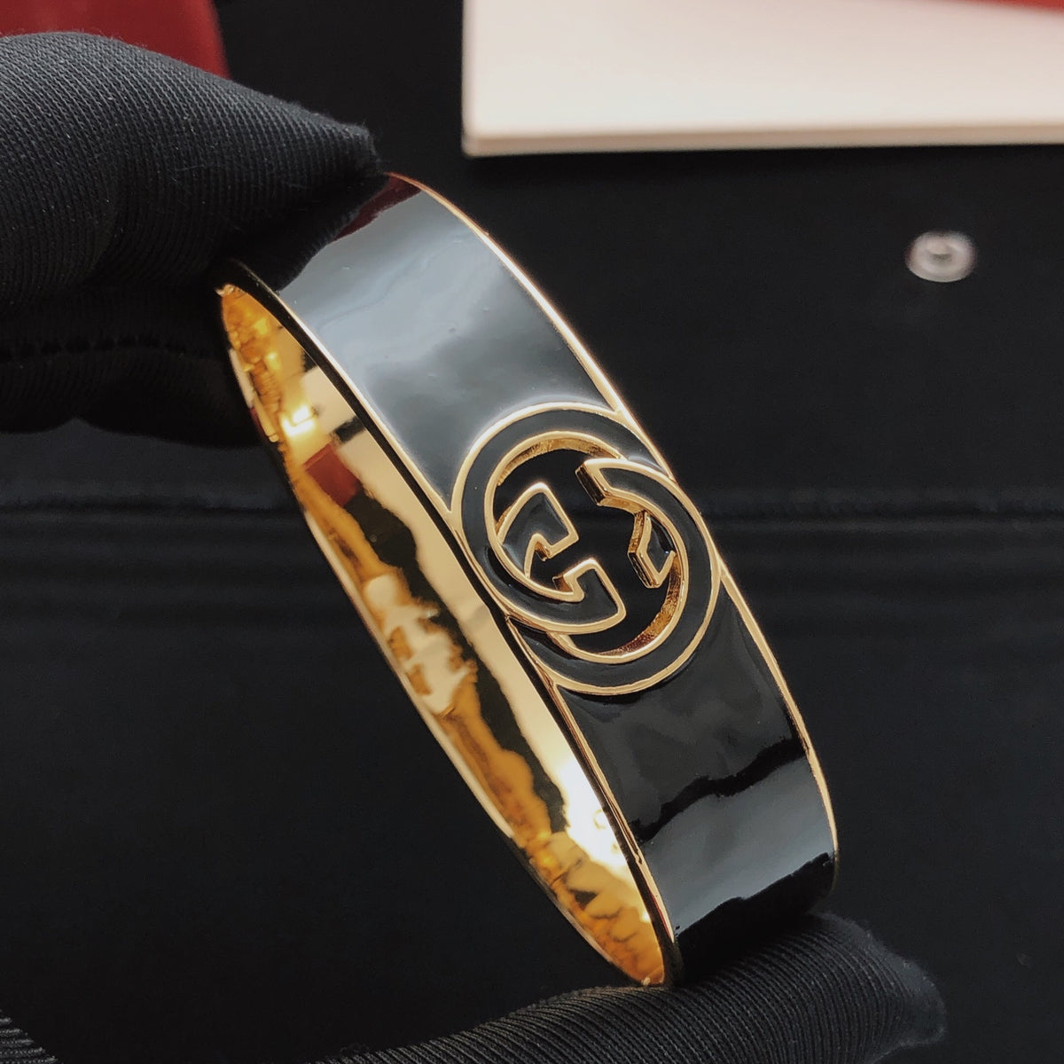 Geometric Emblem Bangle in Gold-Tone – Black Detail front product view