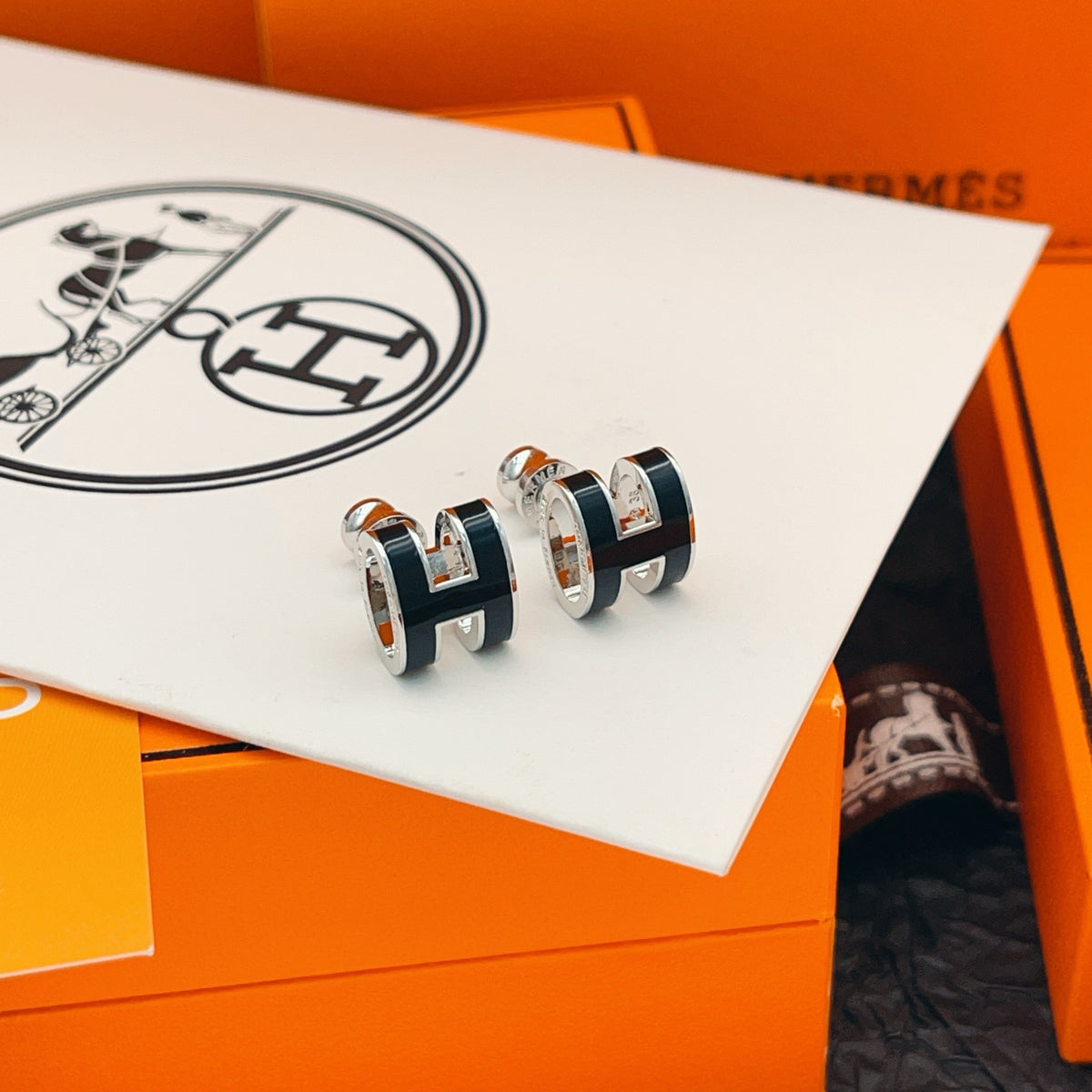 Geometric Emblem Stud Earrings in Silver-Tone close-up detail
