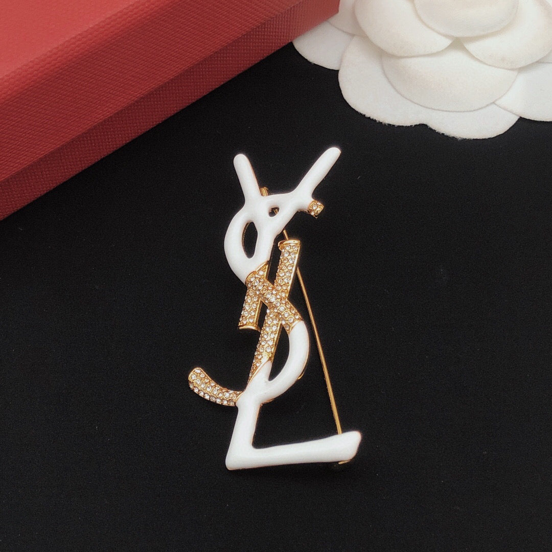 Geometric Emblem Brooch in Gold-Tone – White Detail detail view