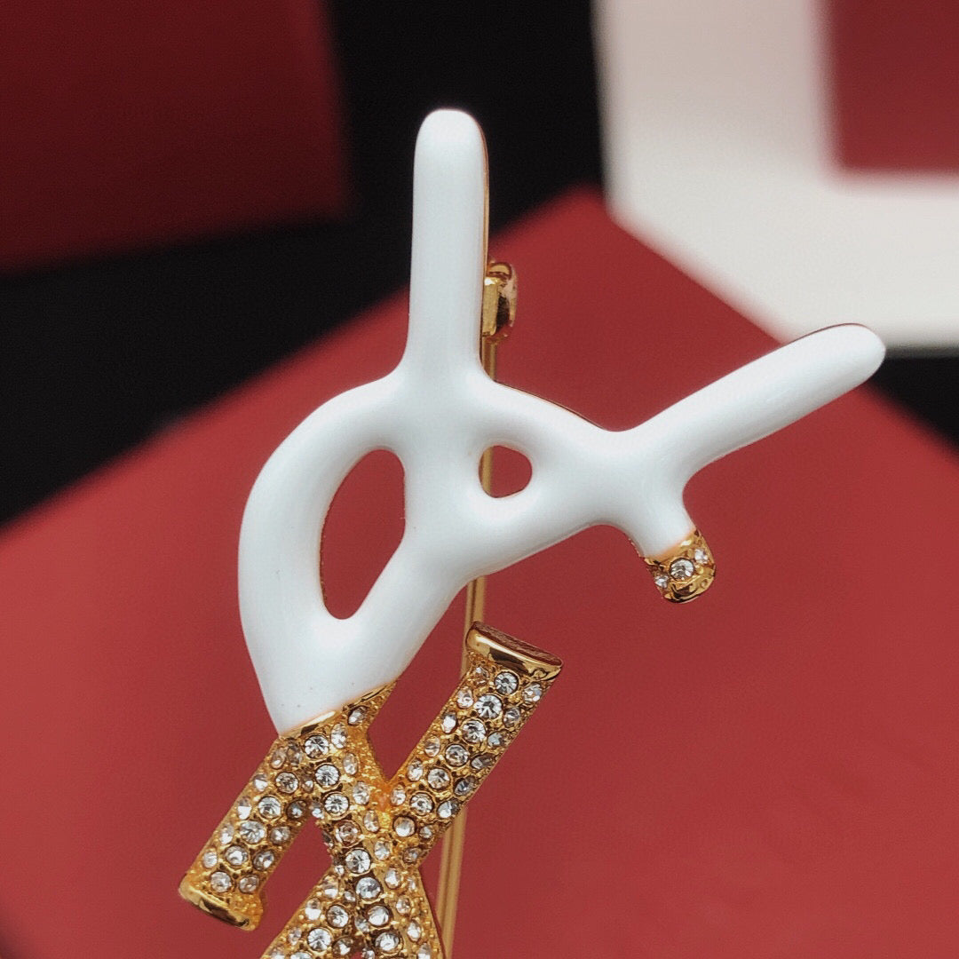 Geometric Emblem Brooch in Gold-Tone – White Detail close-up detail