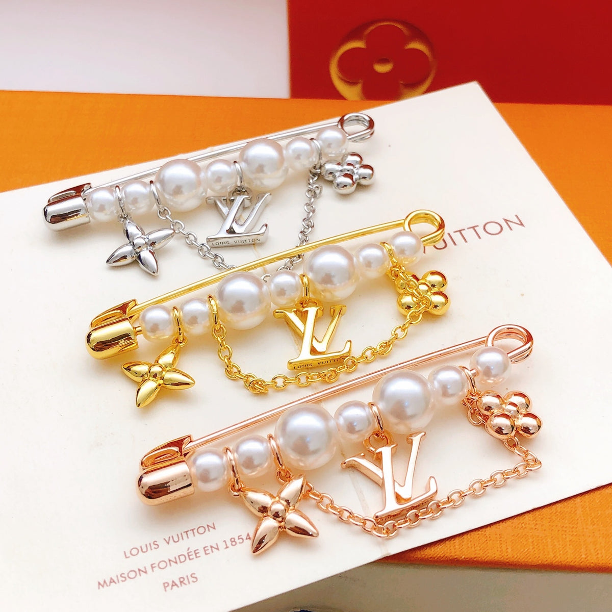 Geometric Emblem Brooch in Gold-Tone – Pearl Detail detail view
