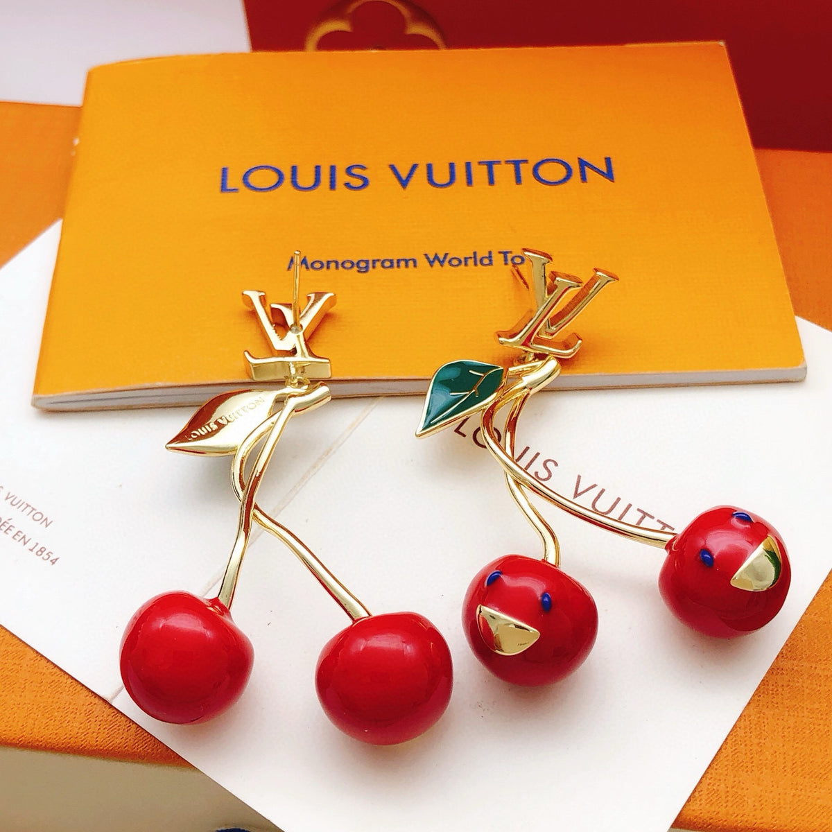 Geometric Emblem Stud Earrings in Gold-Tone – Red Detail front product view