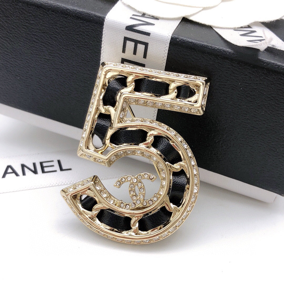 Signature Emblem Brooch in Polished Metal-Tone – Design 041 close-up detail