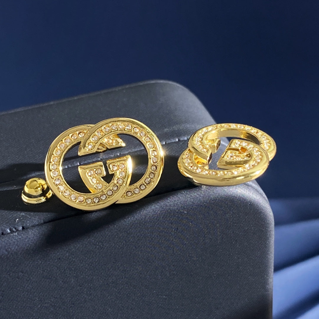 Double-G Emblem Brooch in Gold-Tone – Crystal Detail detail view