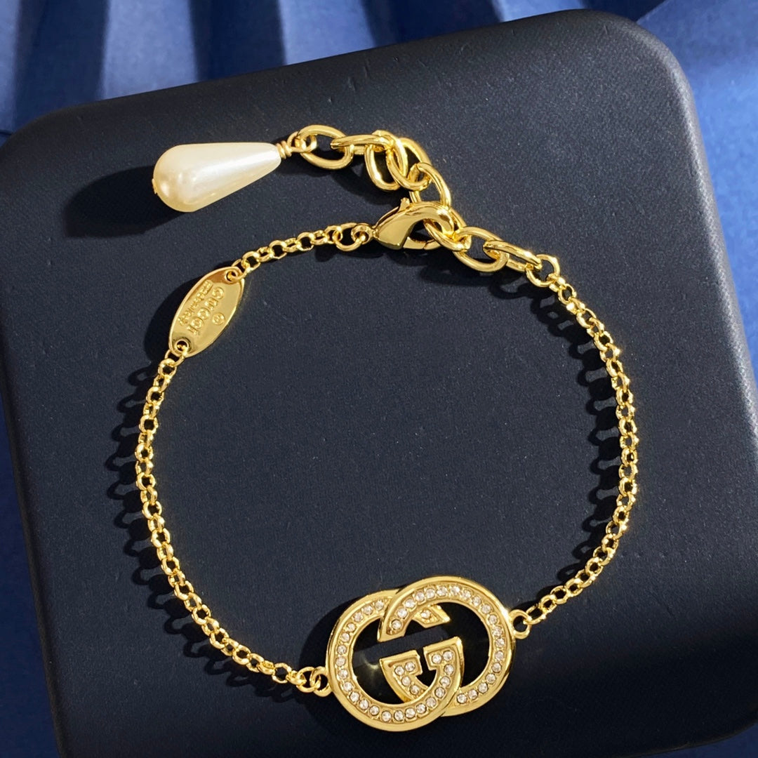 Double-G Emblem Brooch in Gold-Tone – Crystal Detail – Design 003 main product view