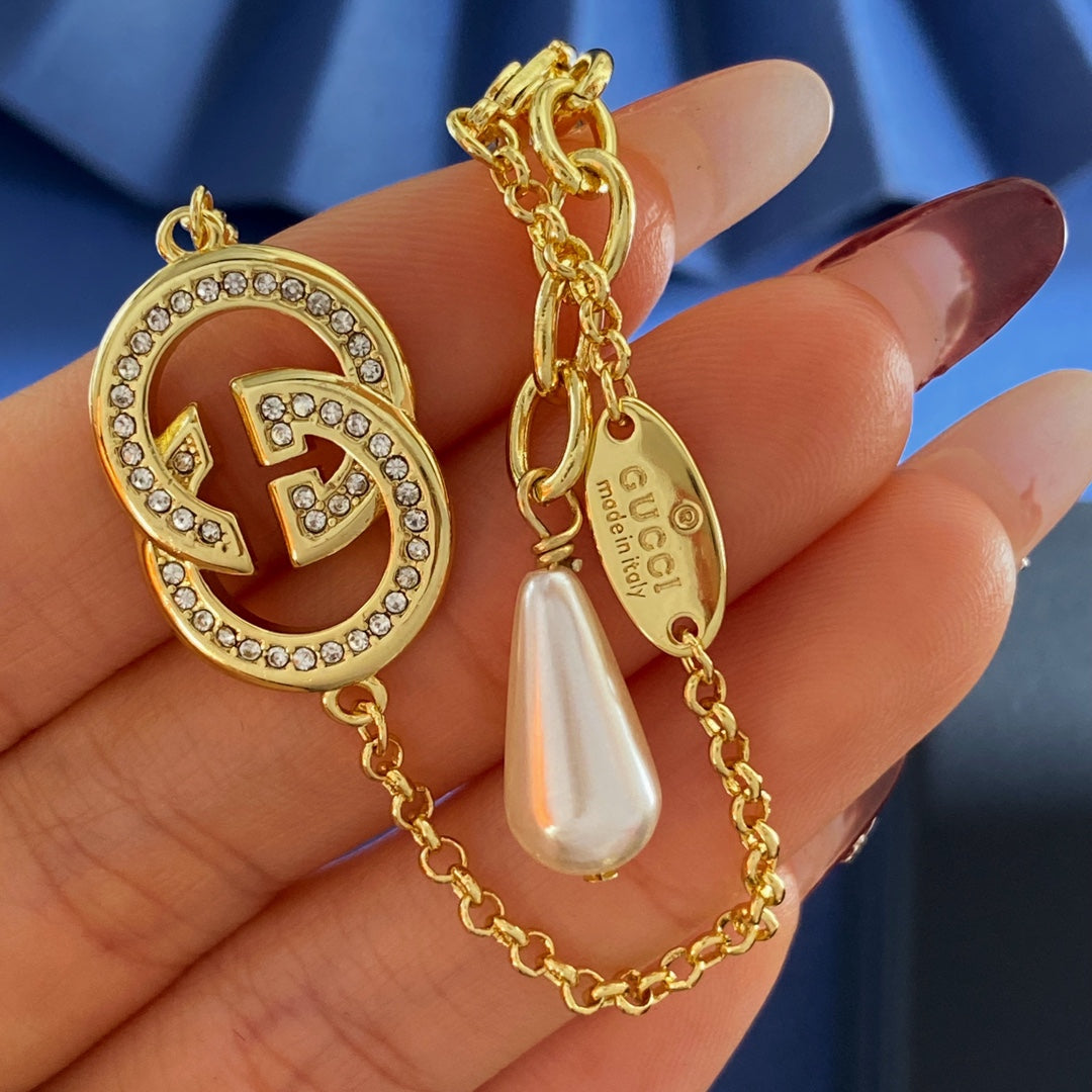 Double-G Emblem Brooch in Gold-Tone – Crystal Detail – Design 003 styled product view