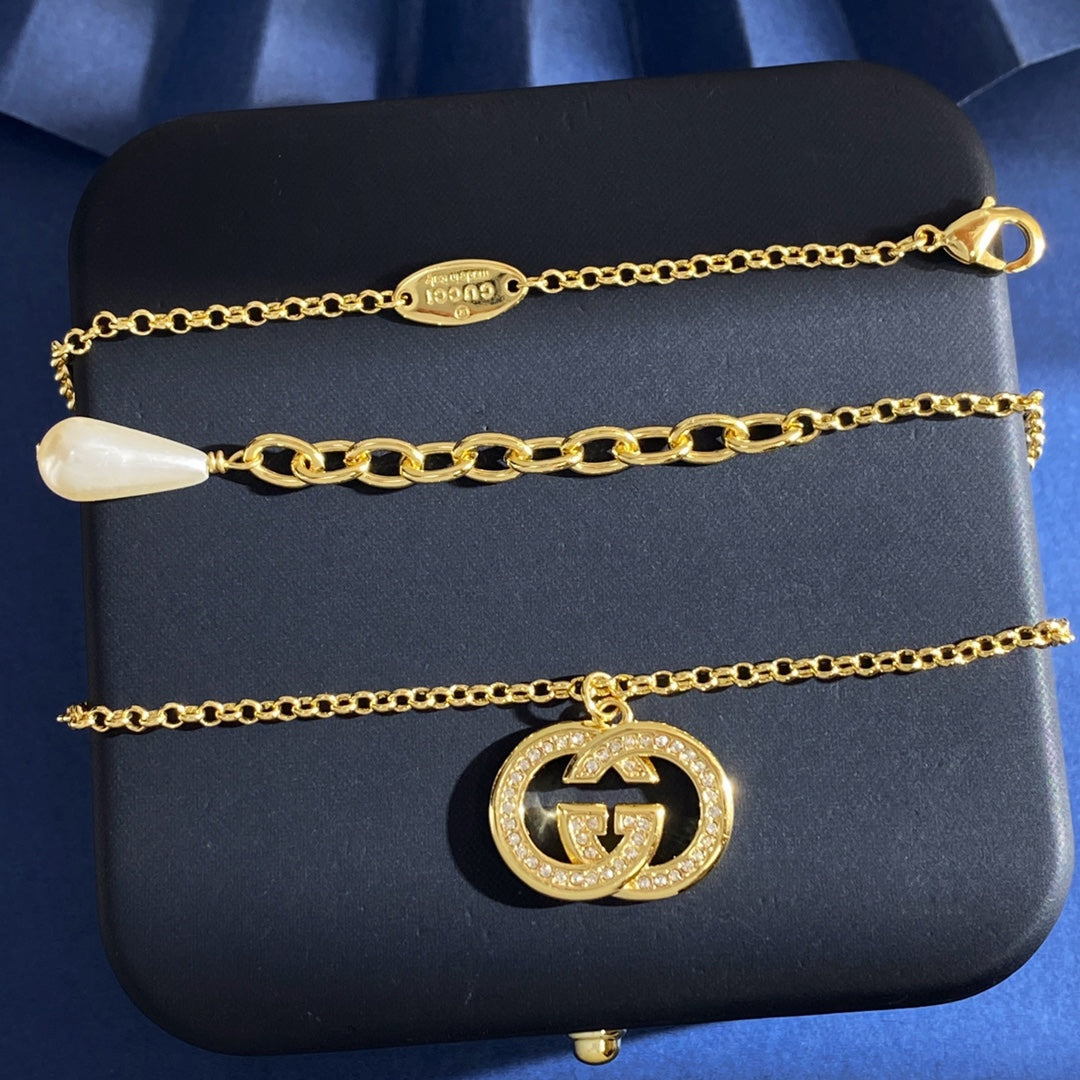 Double-G Emblem Brooch in Gold-Tone – Crystal Detail – Design 004 main product view