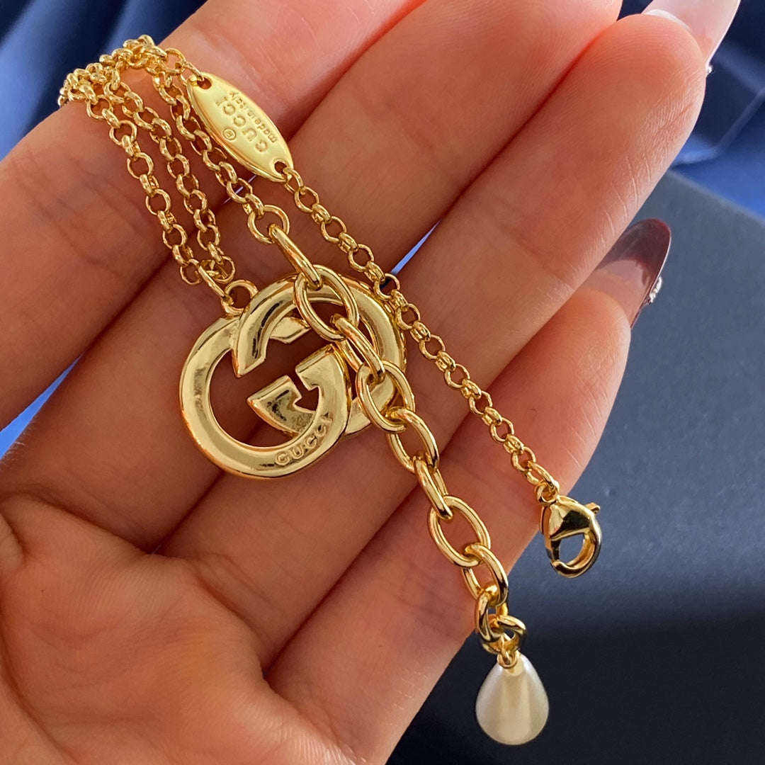 Double-G Emblem Brooch in Gold-Tone – Crystal Detail – Design 004 styled product view