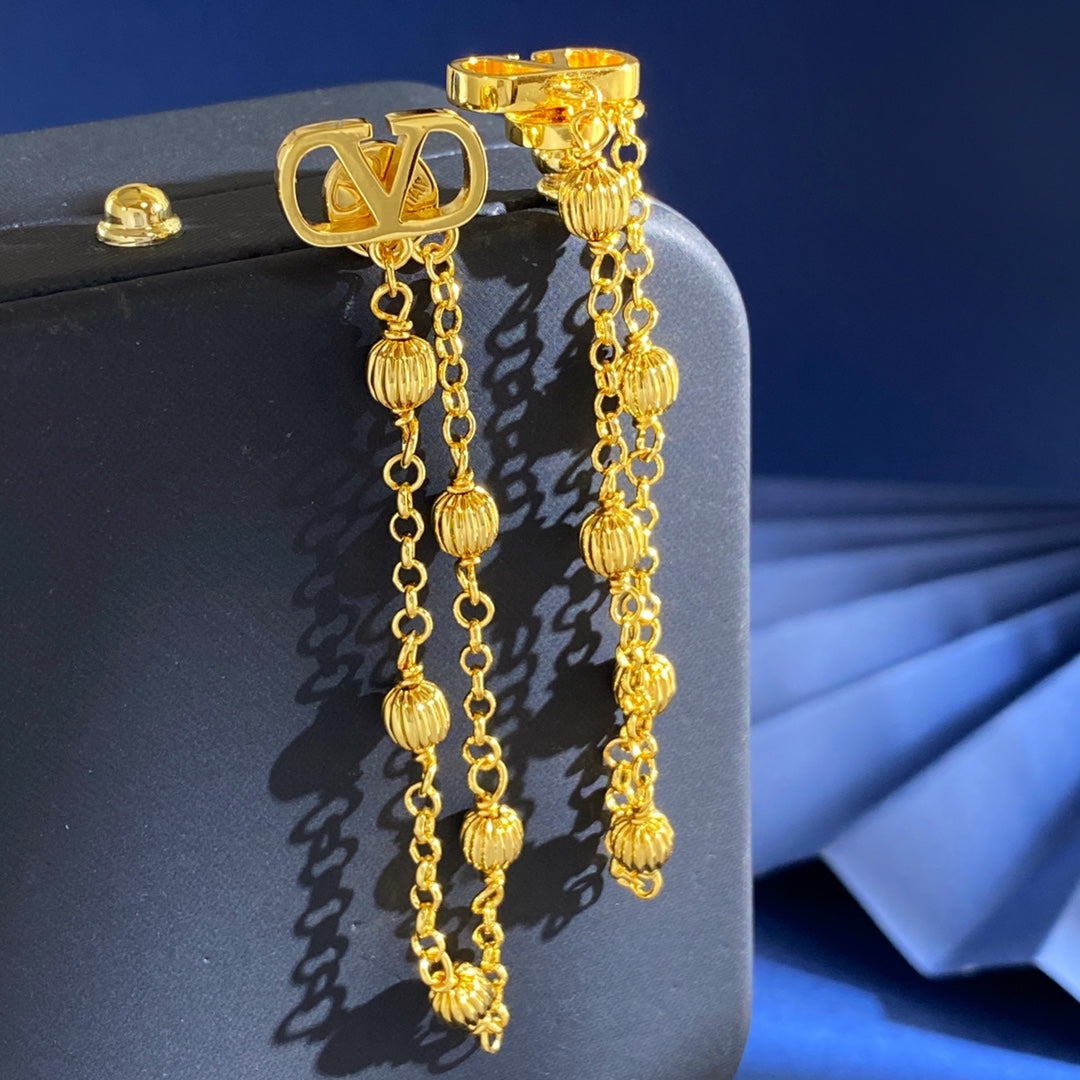 V Emblem Stud Earrings in Gold-Tone detail view