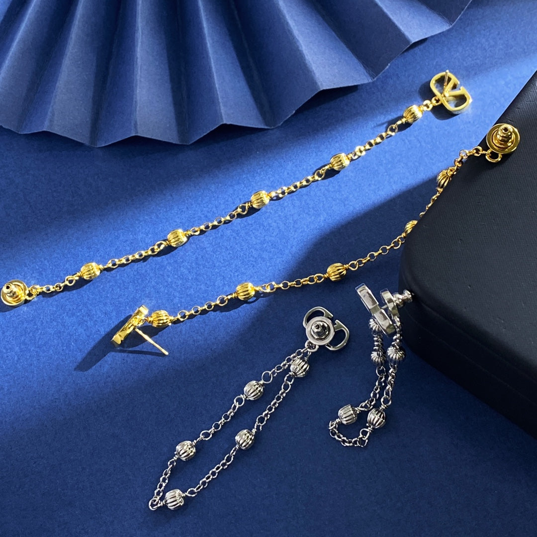 V Emblem Stud Earrings in Gold-Tone detail view