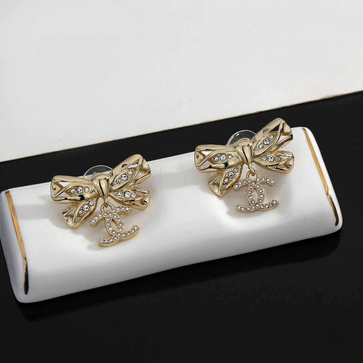 Double-C Emblem Stud Earrings in Polished Metal-Tone – Design 185 styled product view