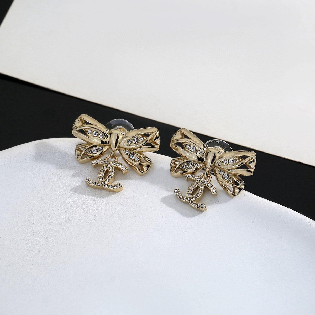 Double-C Emblem Stud Earrings in Polished Metal-Tone – Design 185 front product view
