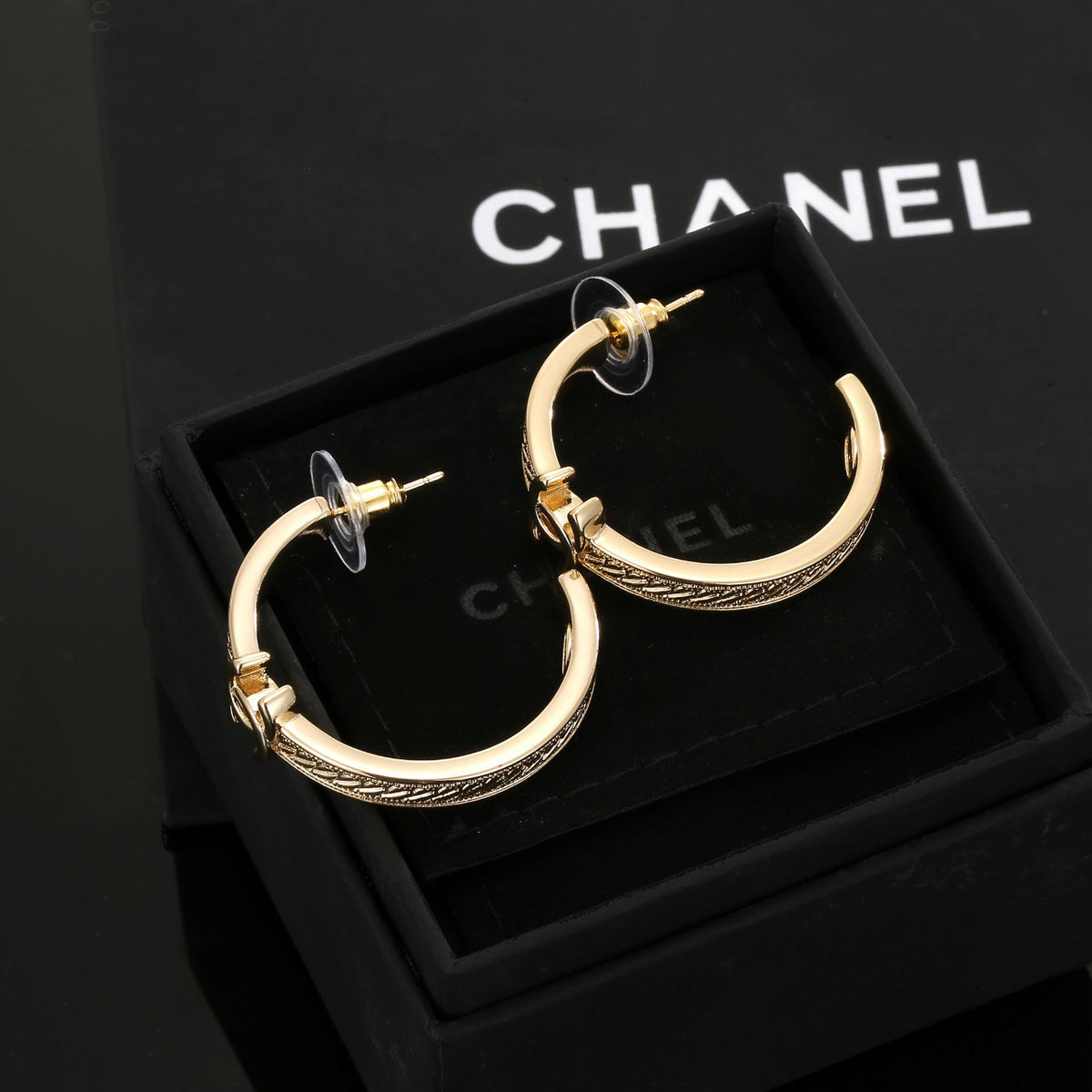 Signature Emblem Stud Earrings in Polished Metal-Tone – Design 018 detail view