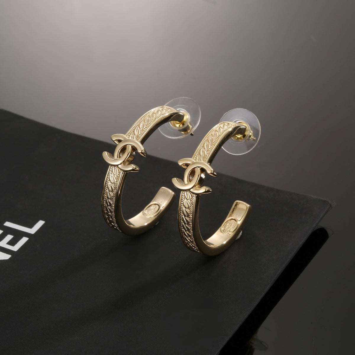 Signature Emblem Stud Earrings in Polished Metal-Tone – Design 018 main product view