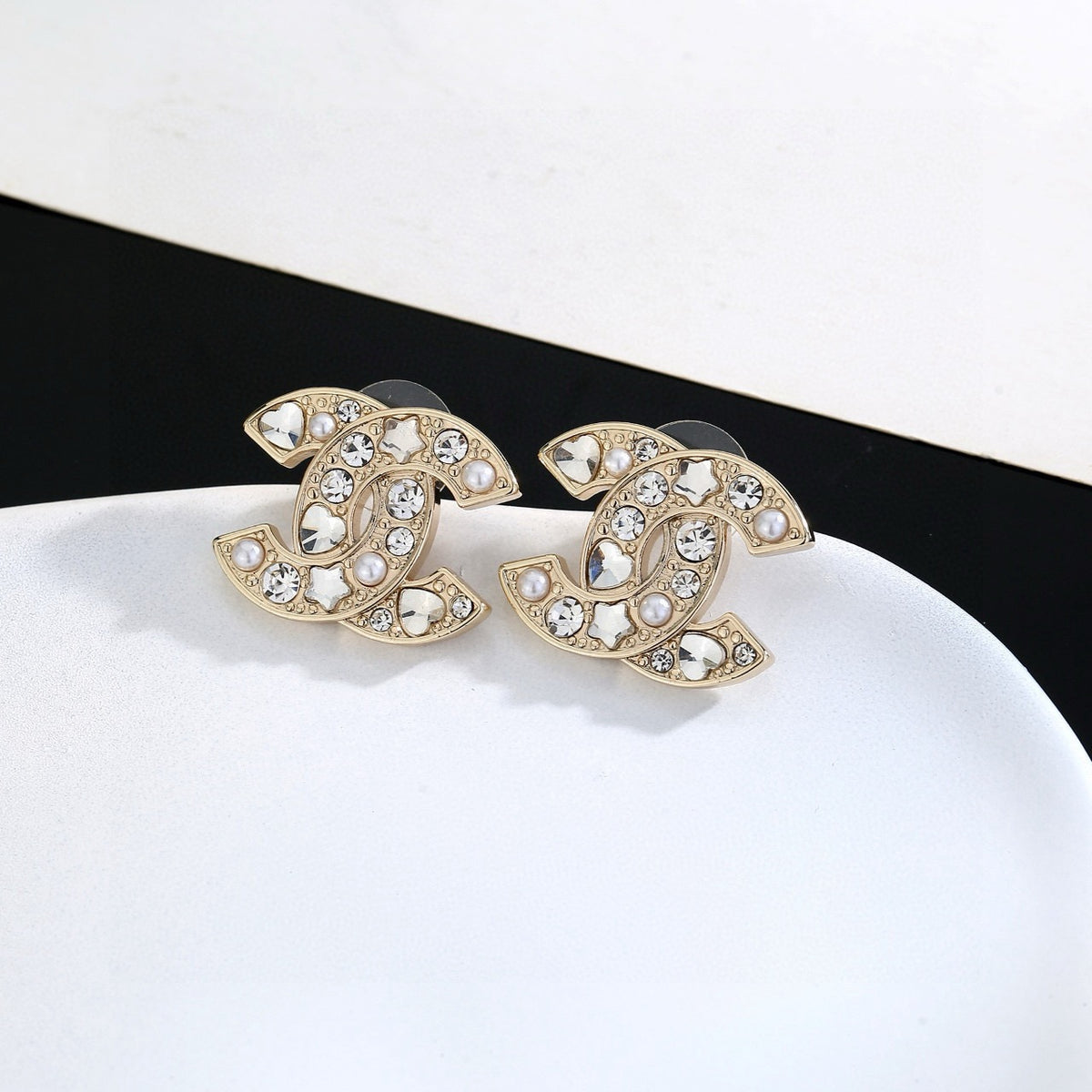 Double-C Emblem Stud Earrings in Gold-Tone – Star Detail – Design 004 close-up detail
