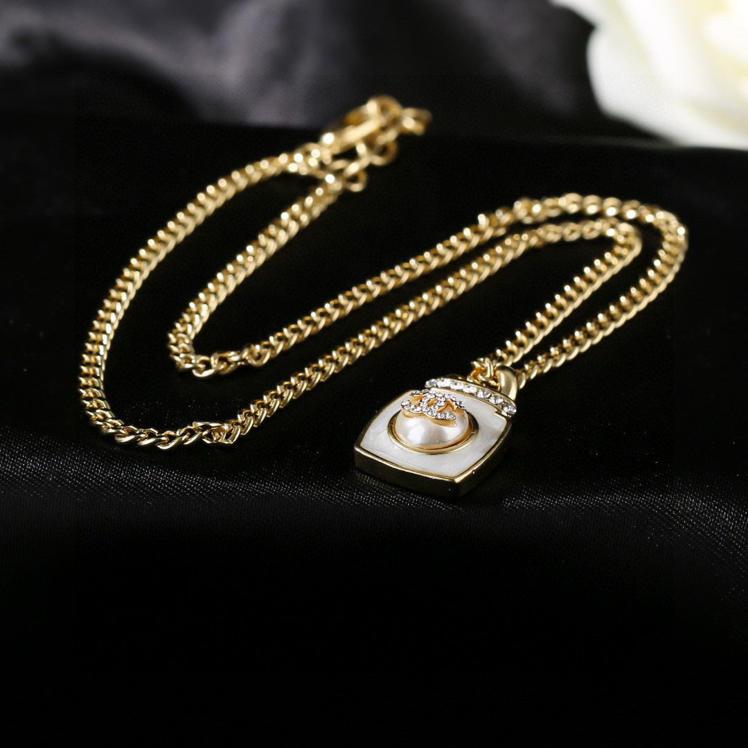 Double-C Emblem Pendant Necklace in Gold-Tone – Design 016 detail view