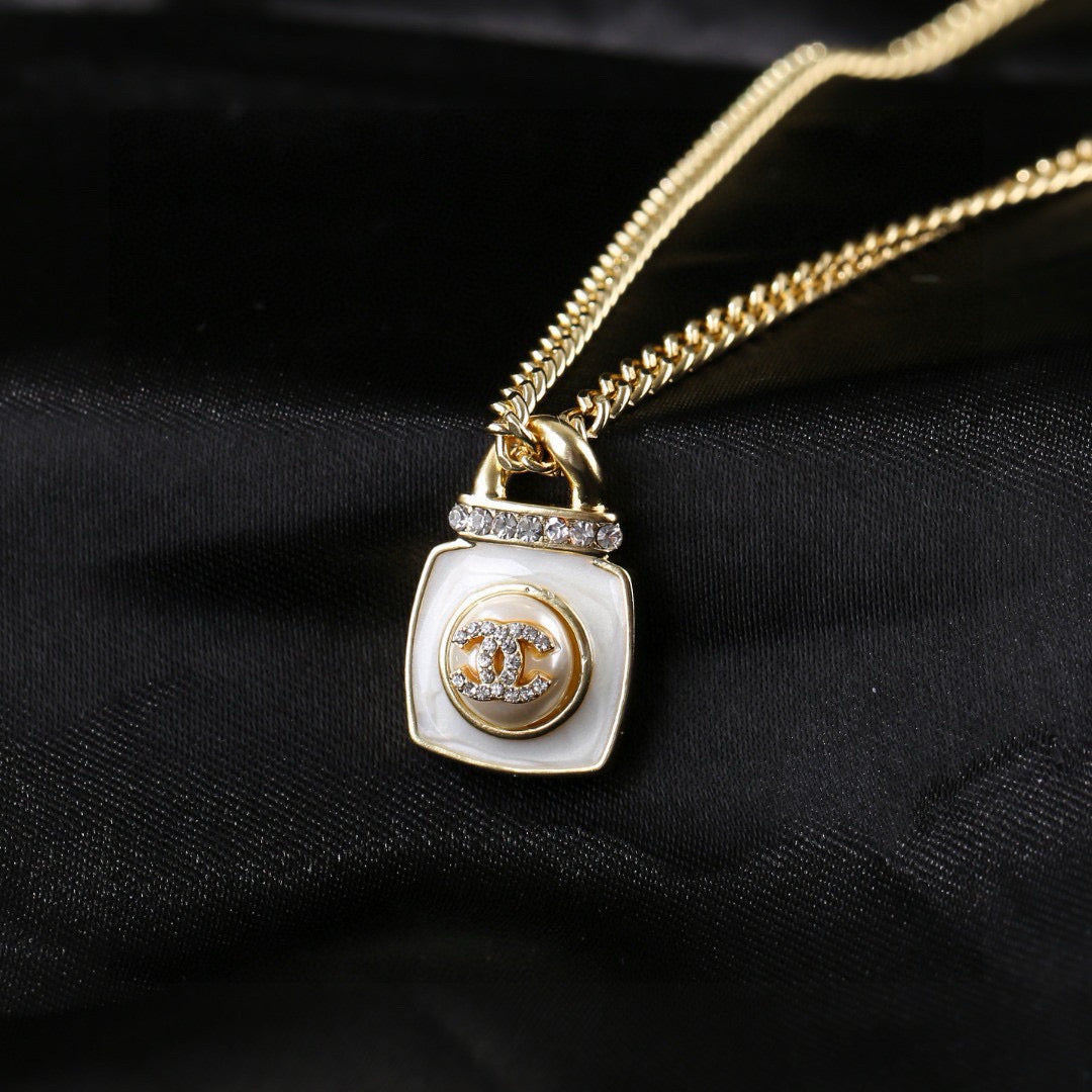 Double-C Emblem Pendant Necklace in Gold-Tone – Design 016 close-up detail