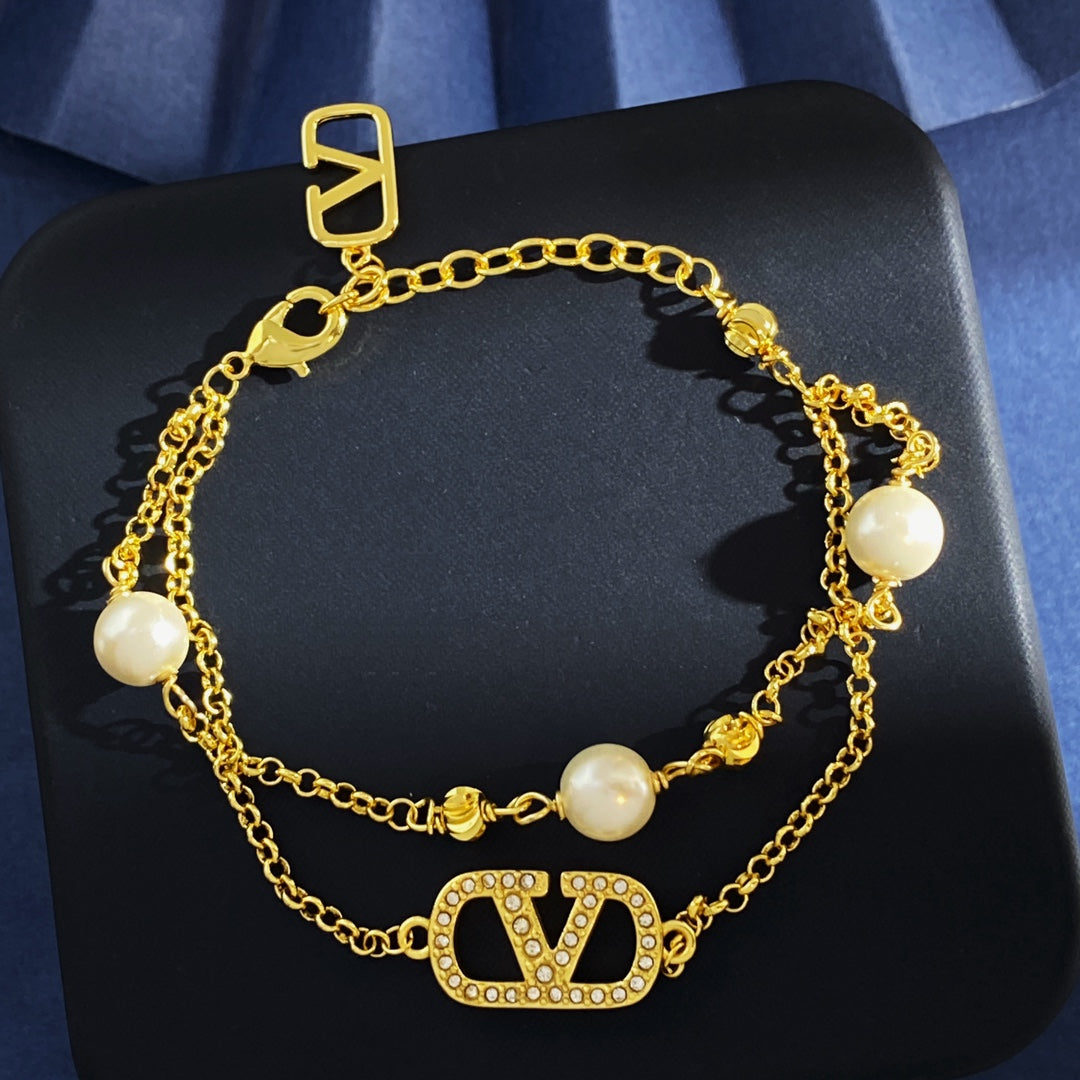V Emblem Jewelry Accessory – White side detail