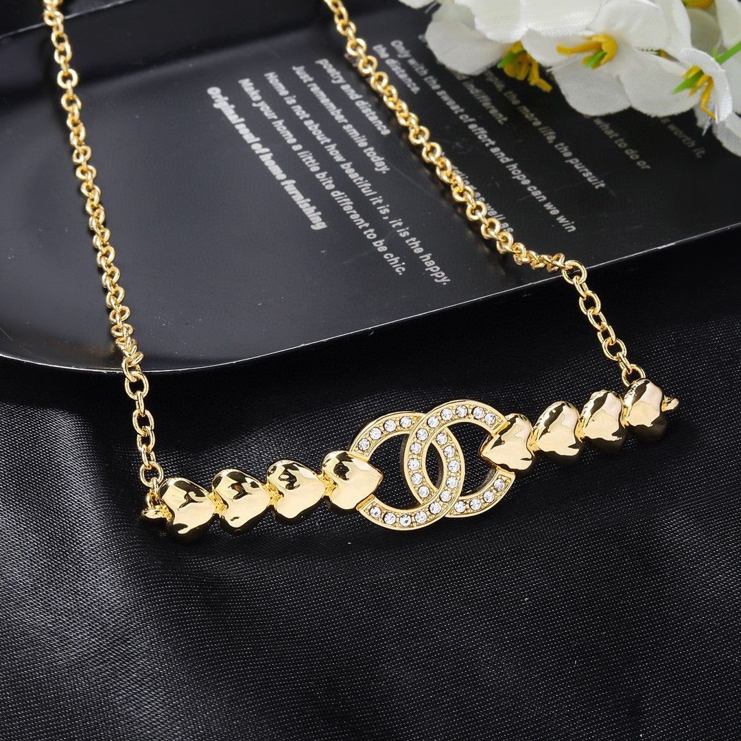 Double-C Emblem Pendant Necklace in Gold-Tone – Design 009 close-up detail
