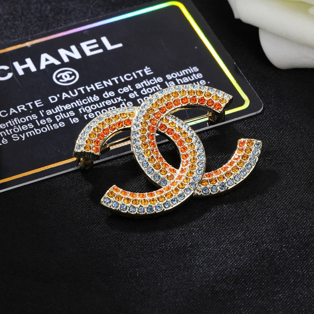 Double-C Emblem Brooch in Polished Metal-Tone – Design 013 close-up detail