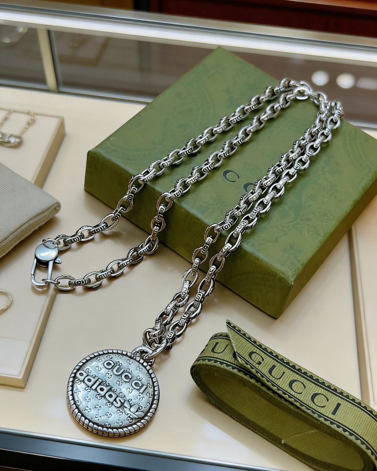 Double-G Emblem Pendant Necklace in Polished Metal-Tone – Vintage Detail – Design 013 close-up detail