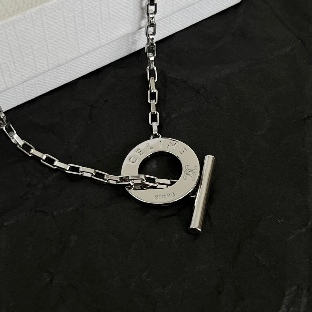 Signature Emblem Pendant Necklace in Polished Metal-Tone – Design 01 close-up view