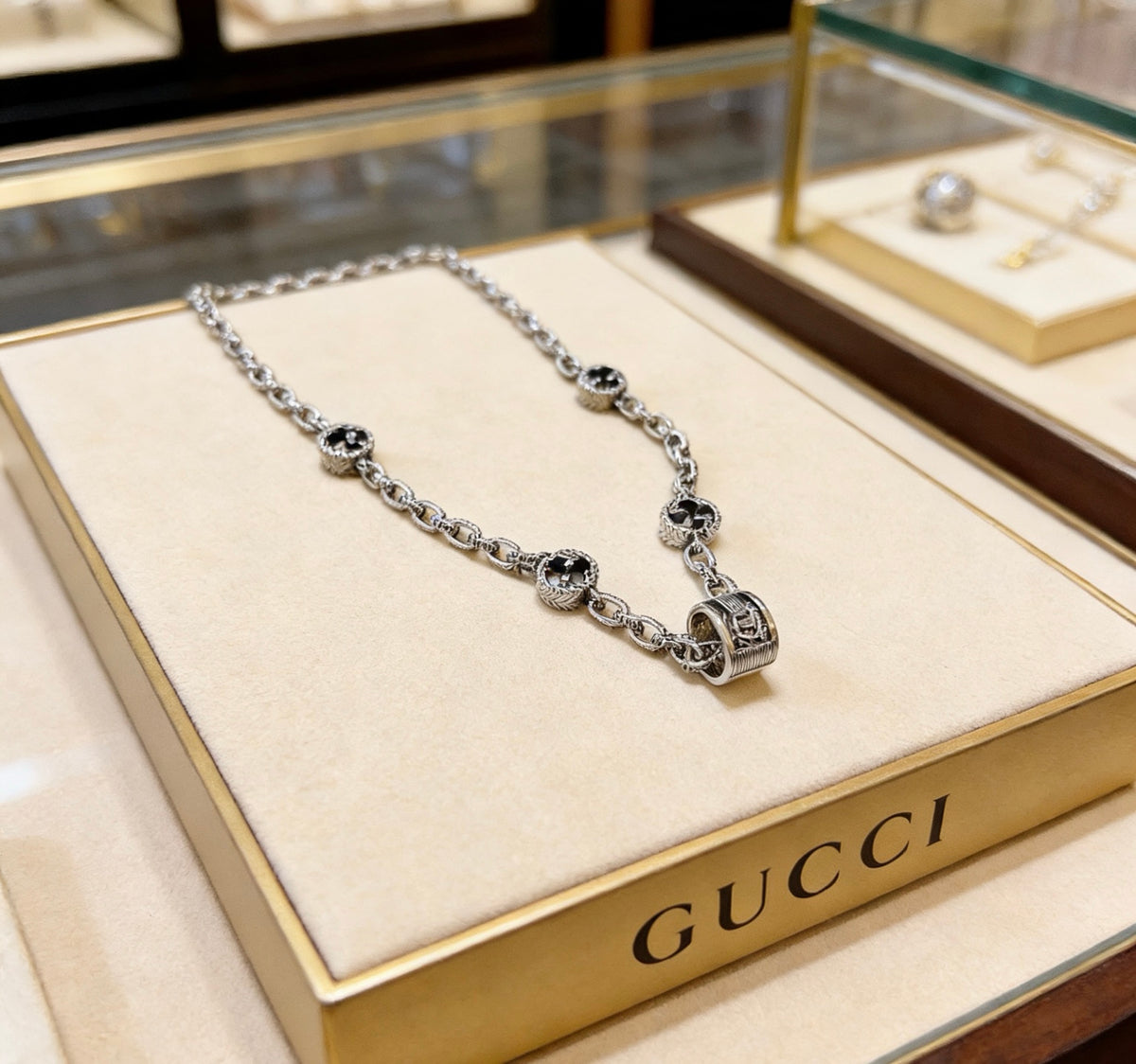 Double-G Emblem Pendant Necklace in Polished Metal-Tone – Design 105 close-up detail