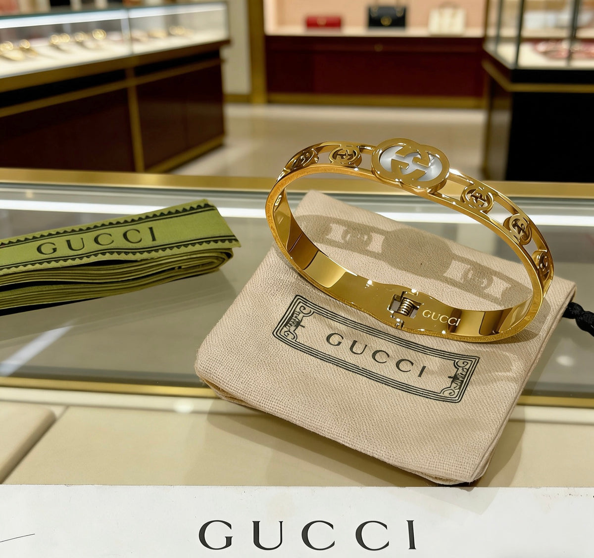 Double-G Emblem Bangle in Polished Metal-Tone – Design 017 close-up detail