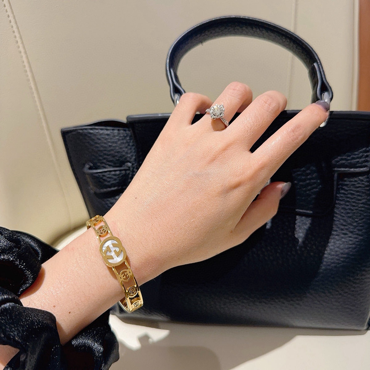 Double-G Emblem Bangle in Polished Metal-Tone – Design 017 styled product view