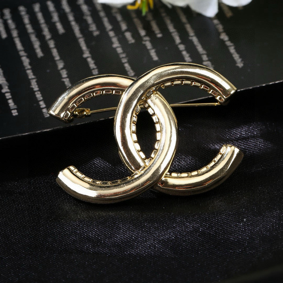 Signature Emblem Brooch in Polished Metal-Tone – Design 008 close-up detail