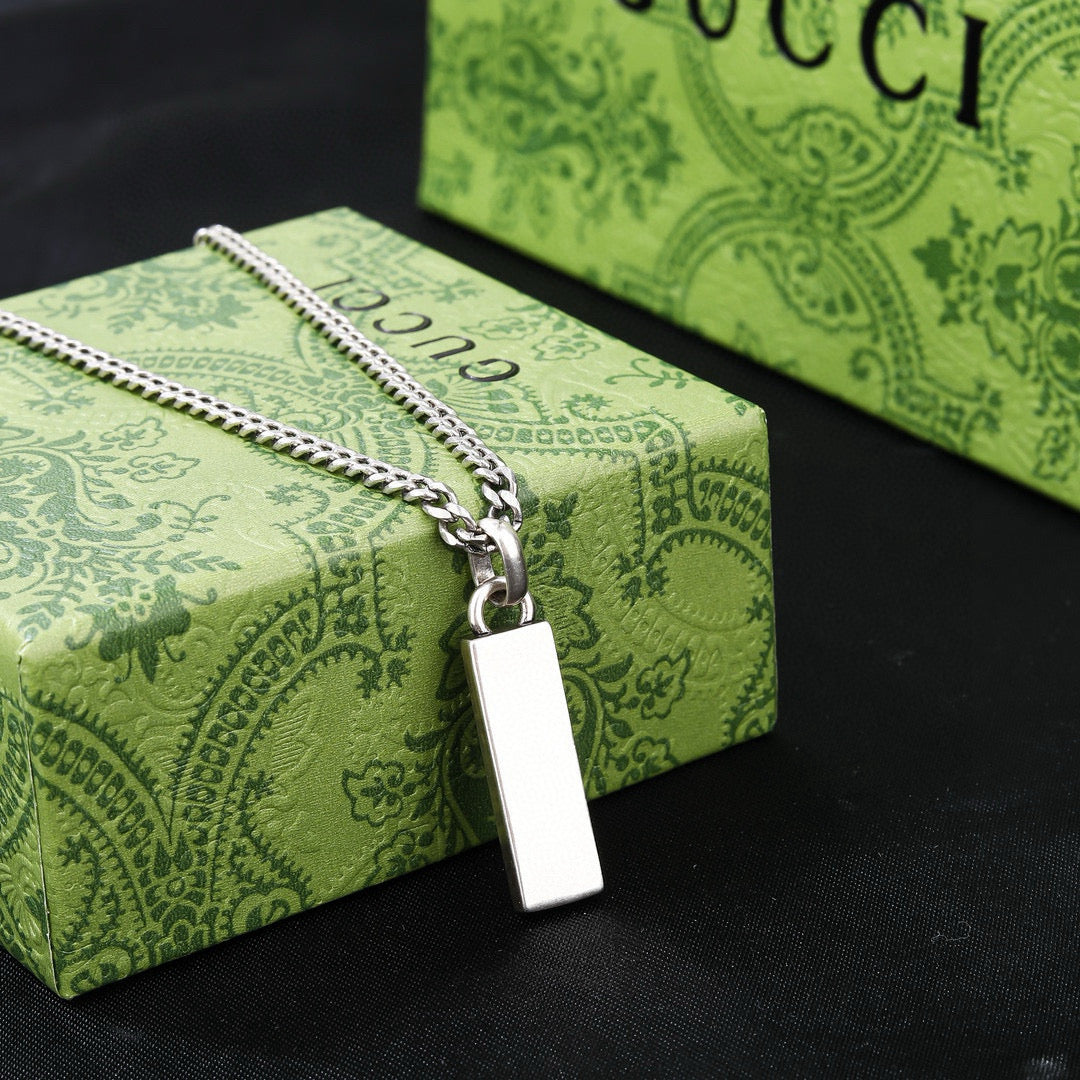 Double-G Emblem Pendant Necklace in Polished Metal-Tone – Design 040 close-up detail