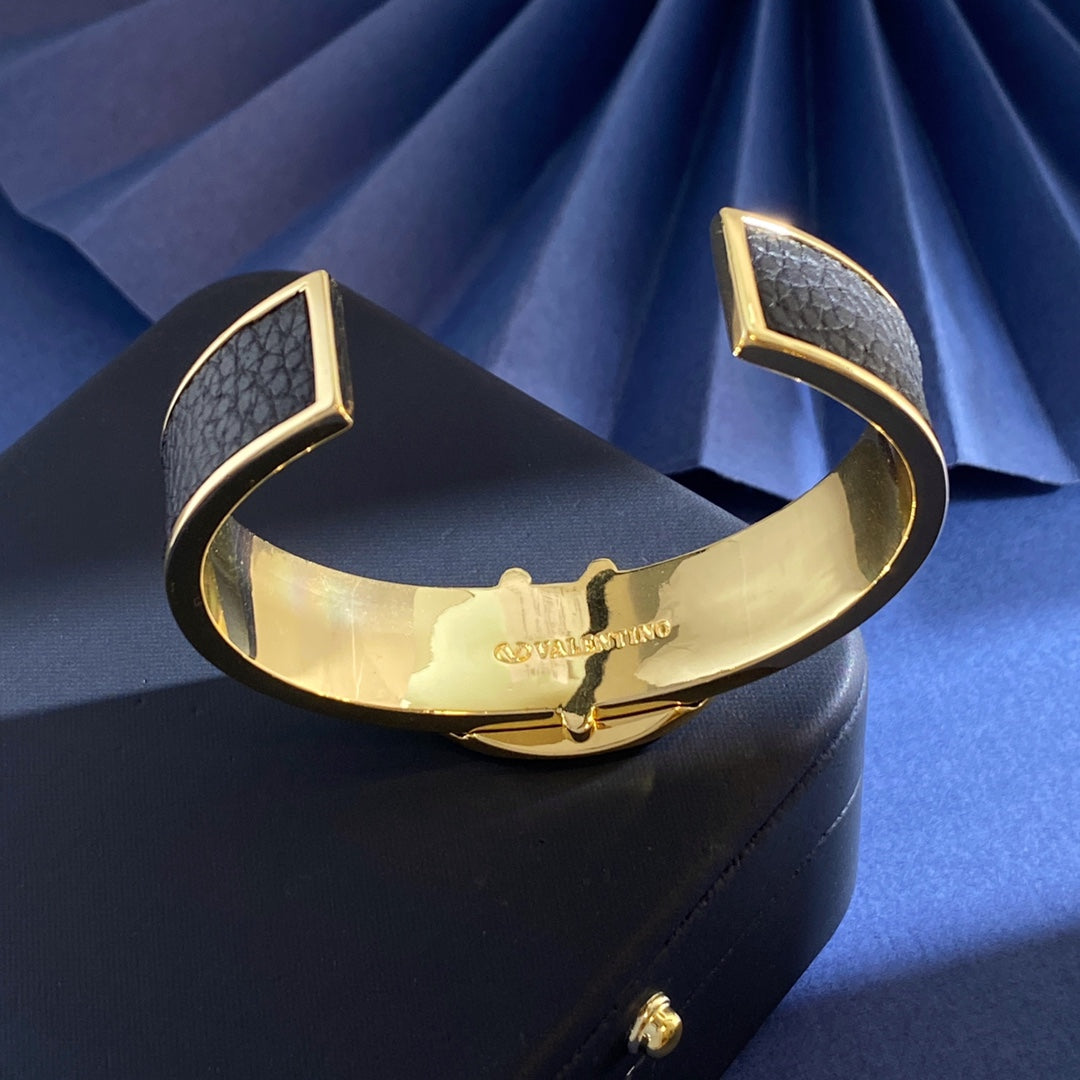 V Emblem Cuff Bracelet in Gold-Tone – Black detail view