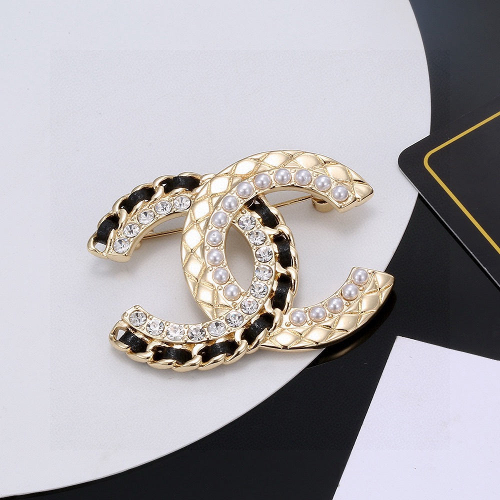 Signature Emblem Brooch in Gold-Tone – Black Detail – Design 002 main product view