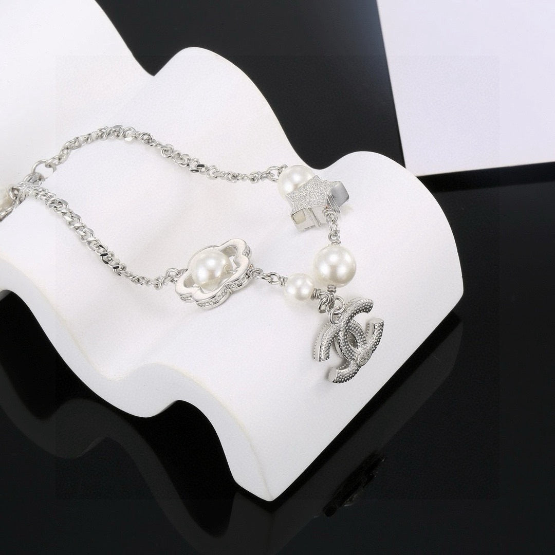 Camellia Bracelet in Polished Metal-Tone – Pearl Detail detail view
