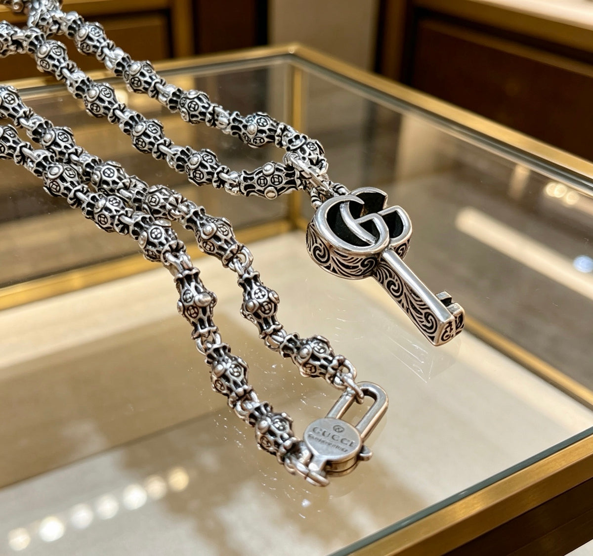 Double-G Emblem Pendant Necklace in Polished Metal-Tone – Design 106 close-up detail