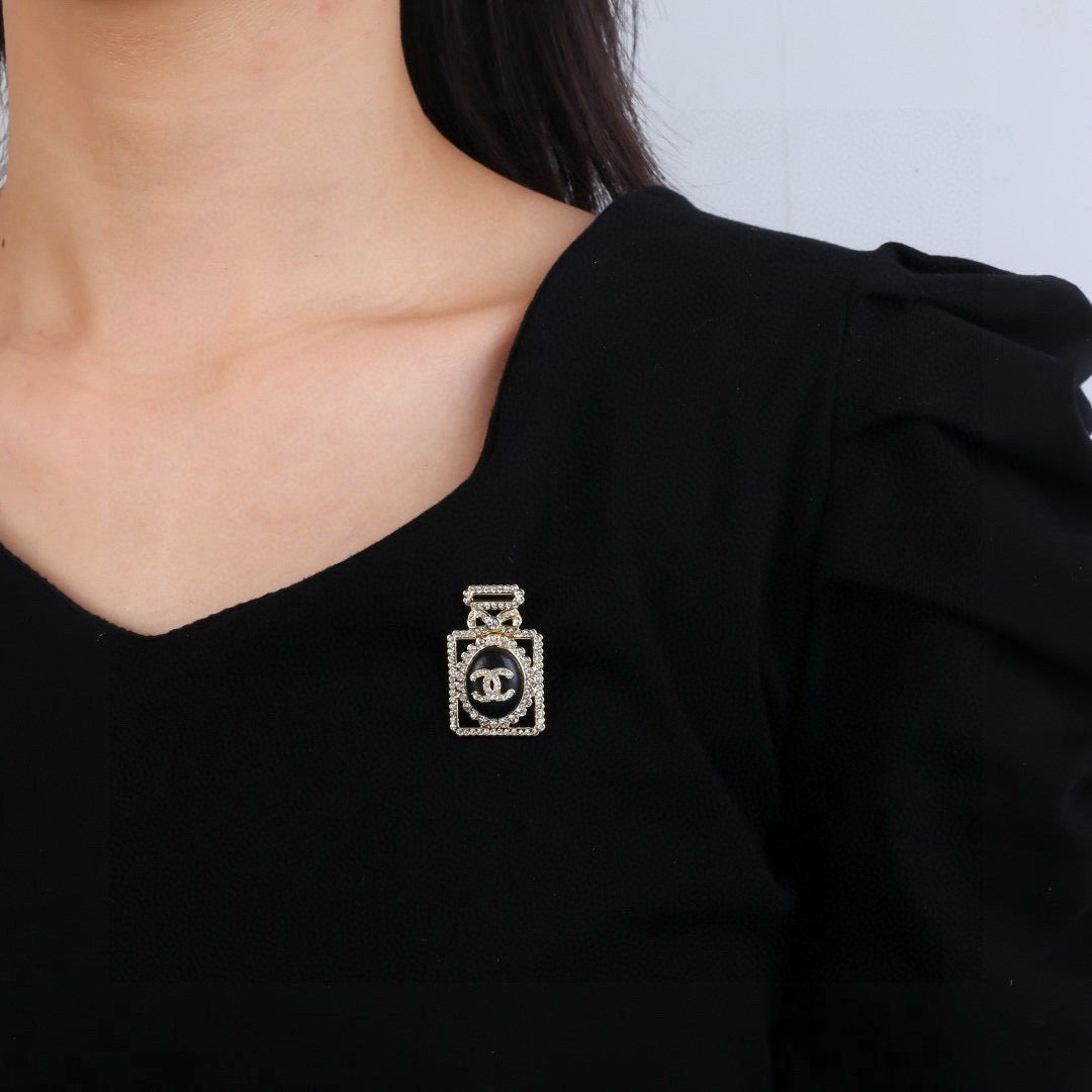 Signature Emblem Brooch in Polished Metal-Tone – Design 021 front product view