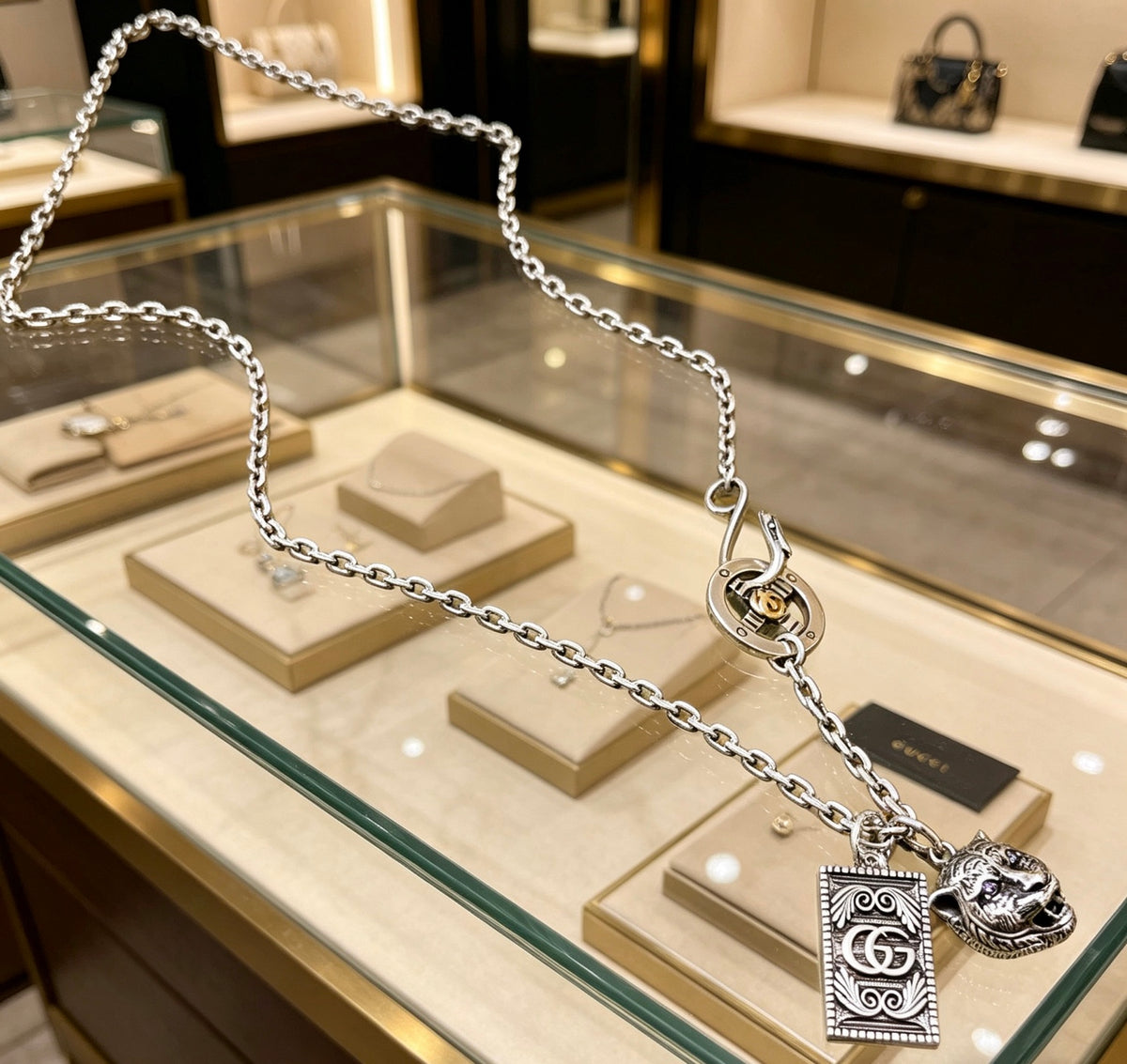 Double-G Emblem Pendant Necklace in Polished Metal-Tone – Vintage Detail – Design 028 close-up detail