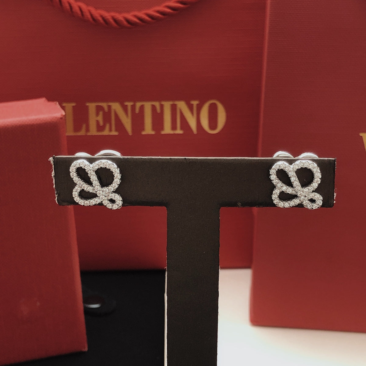 Sculptural Stud Earrings in Polished Metal-Tone with Crystal-Style Accents detail view
