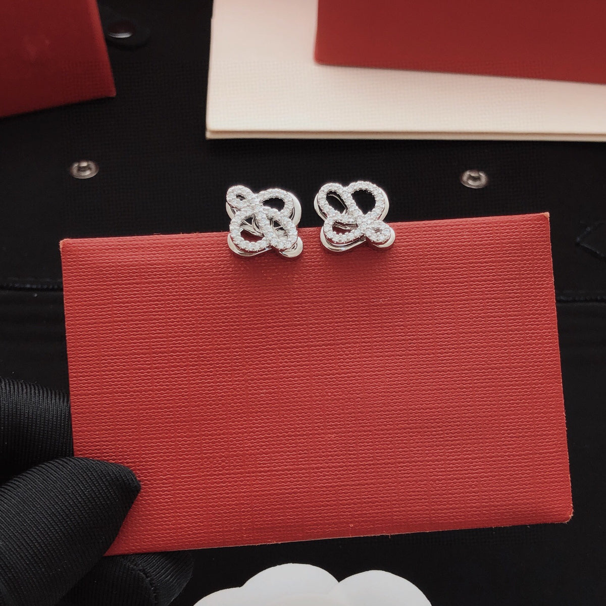 Sculptural Stud Earrings in Polished Metal-Tone with Crystal-Style Accents front view