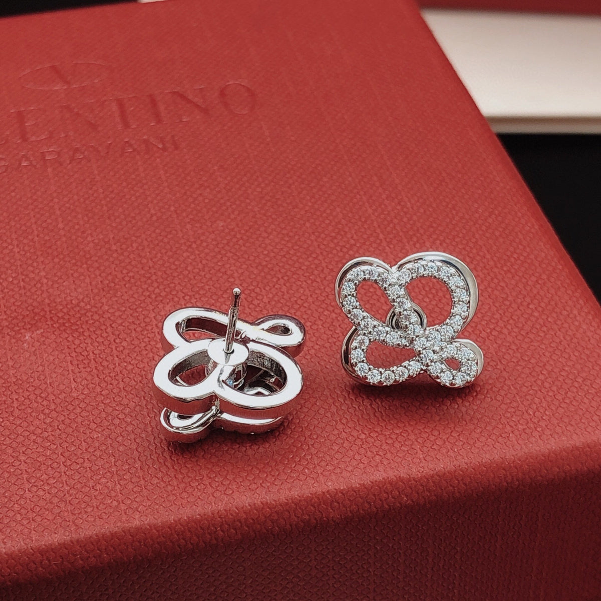 Sculptural Stud Earrings in Polished Metal-Tone with Crystal-Style Accents close-up detail