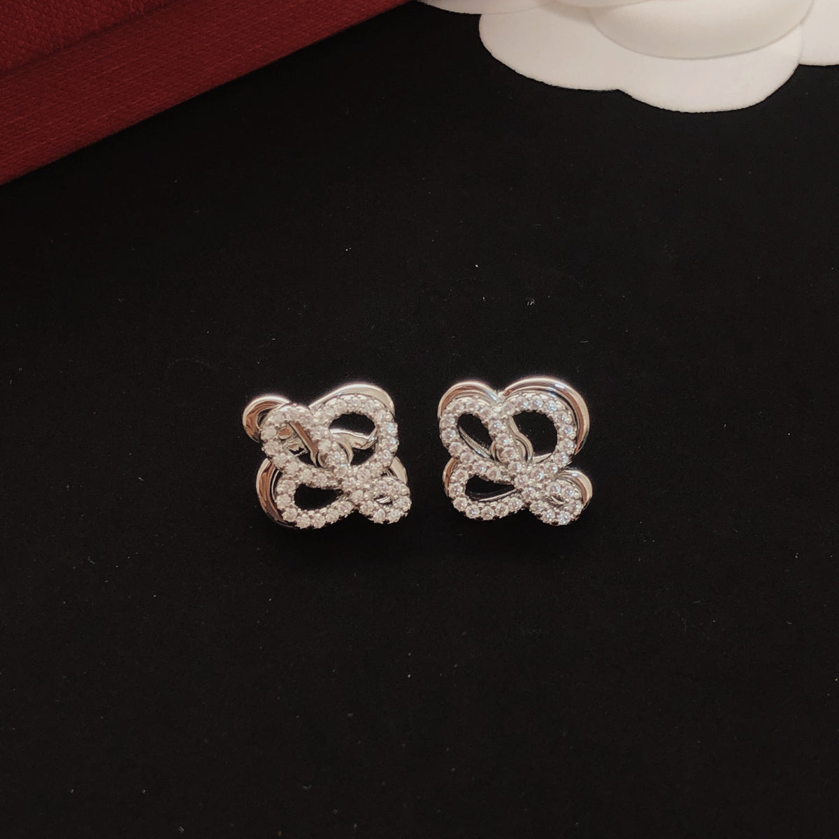 Sculptural Stud Earrings in Polished Metal-Tone with Crystal-Style Accents front view
